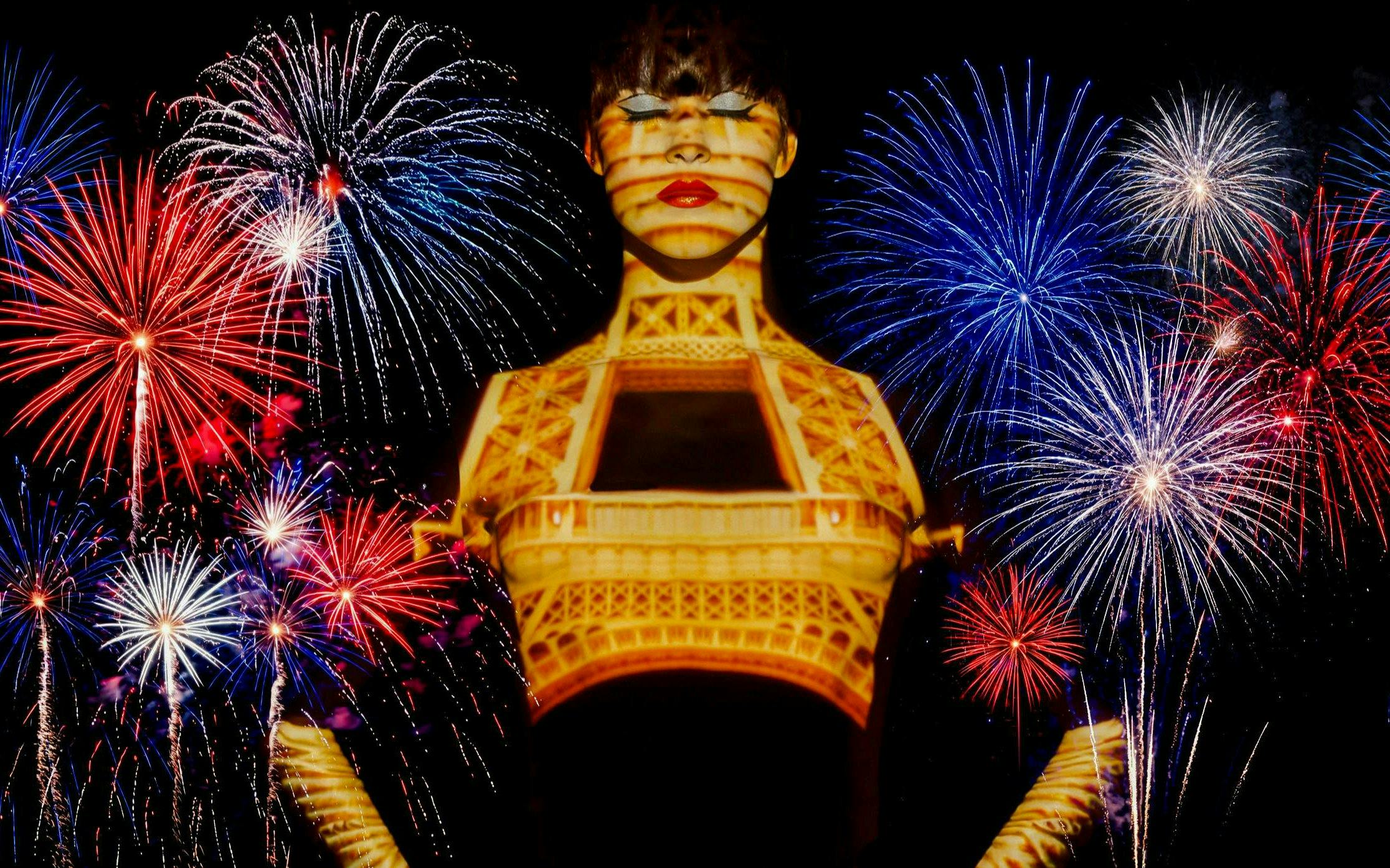 Fireworks over Paris with Eiffel Tower projection during Bastille Day dinner cruise.