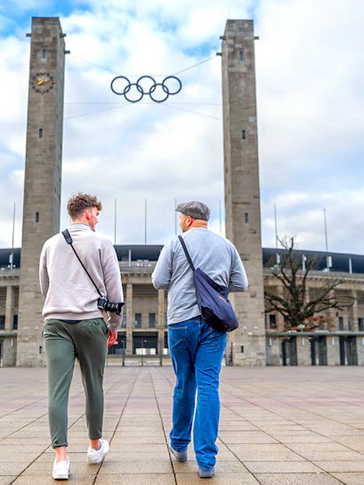Guests walking towards Olympiastadion Berlin entrance.
