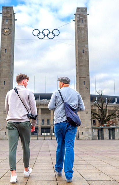 Guests walking towards Olympiastadion Berlin entrance.