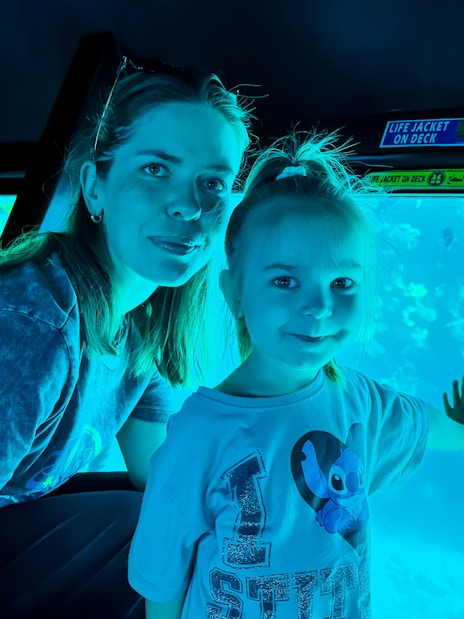 Family with kids viewing fish on Royal Seascope Submarine, Hurghada.