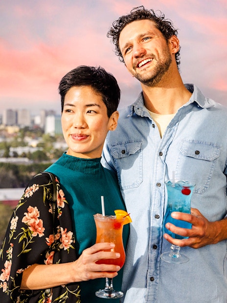 Couple enjoying drinks on the observation wheel at ICON Park, Orlando.