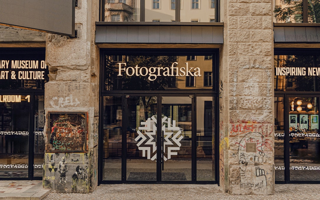 Entrance to Fotografiska Berlin with street art on the facade.