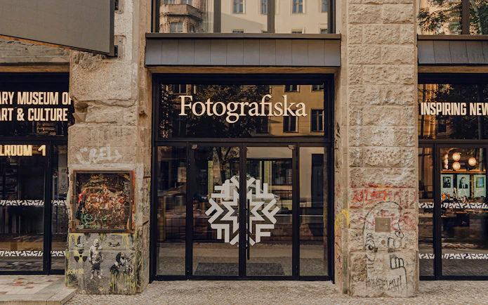 Entrance to Fotografiska Berlin with street art on the facade.