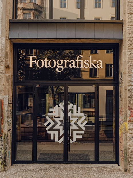 Entrance to Fotografiska Berlin with street art on the facade.