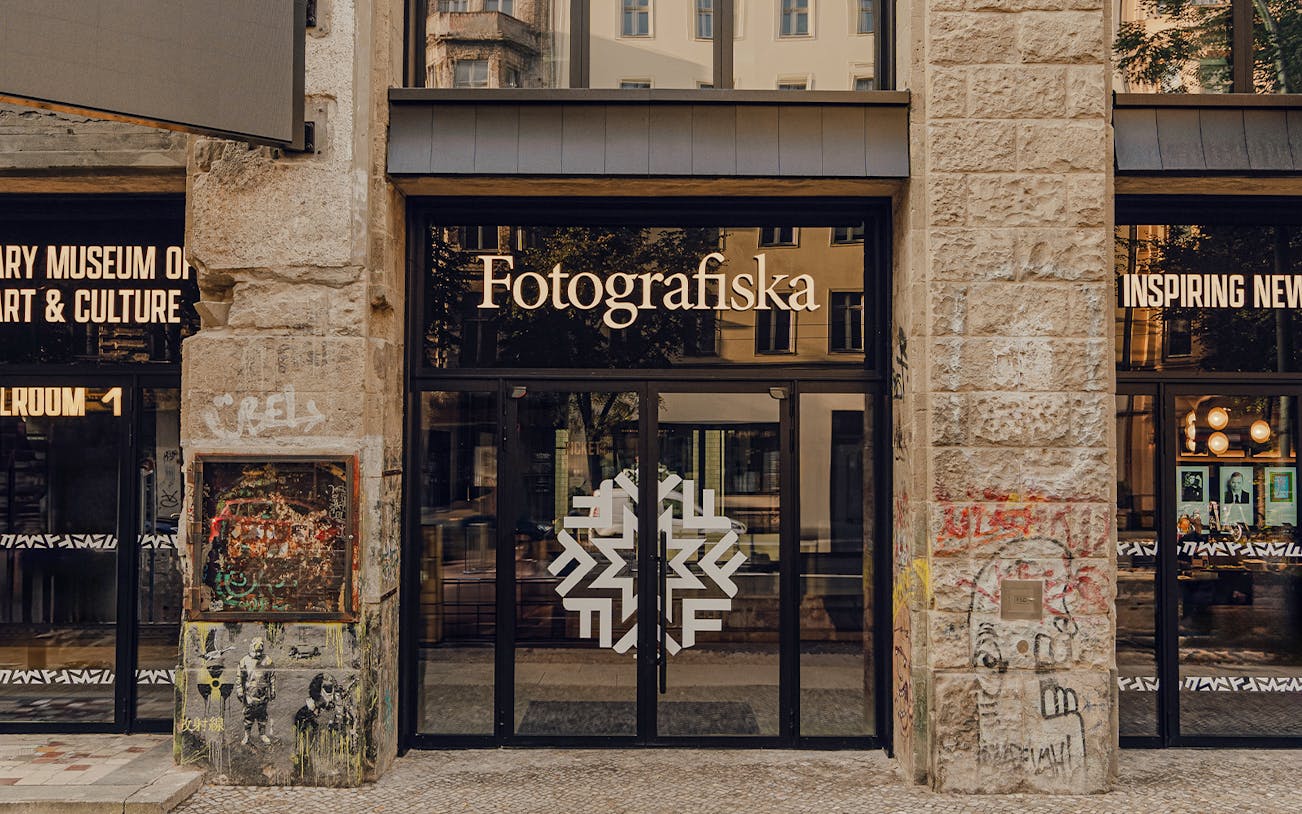 Entrance to Fotografiska Berlin with street art on the facade.