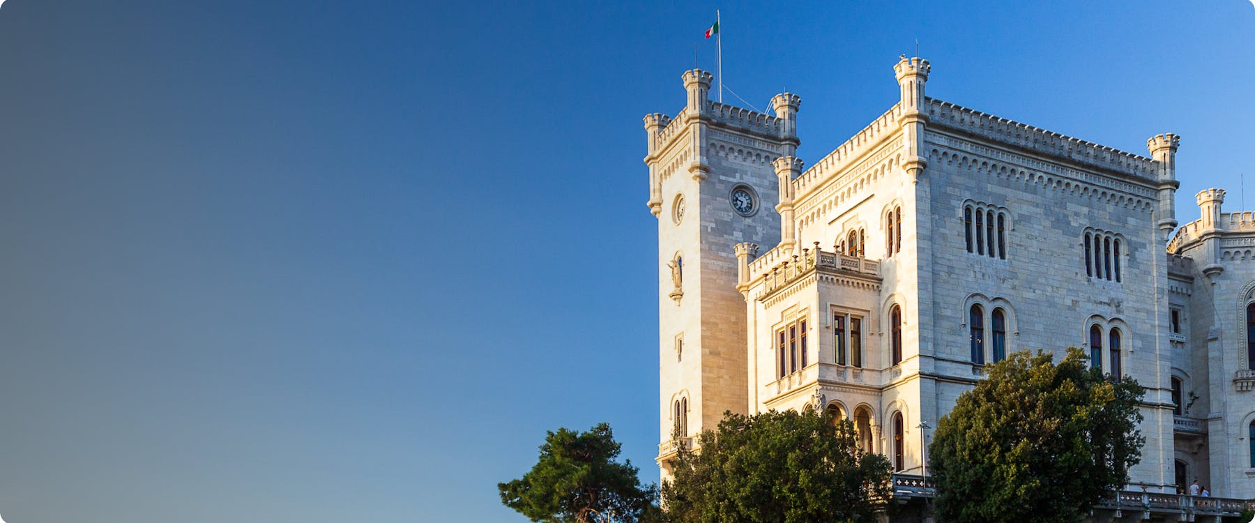 Miramare Castle in Trieste, Italy, with clear blue sky.