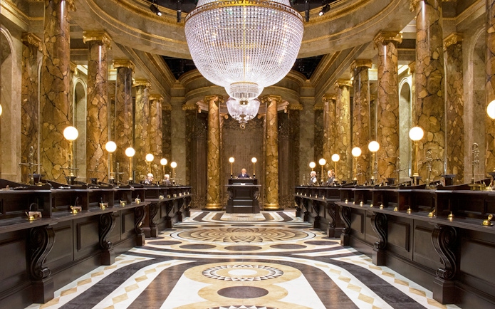 Gringotts Wizarding Bank interior with marble columns and chandeliers, Warner Bros. Studio Tour.