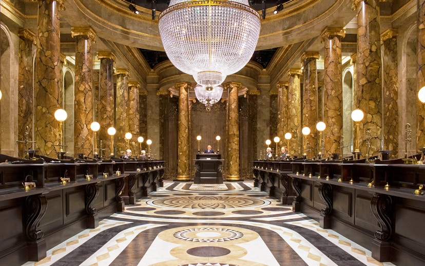 Gringotts Wizarding Bank interior with marble columns and chandeliers, Warner Bros. Studio Tour.