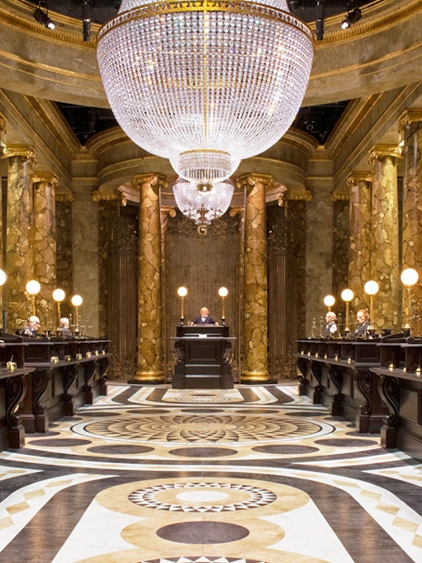 Gringotts Wizarding Bank interior with marble columns and chandeliers, Warner Bros. Studio Tour.