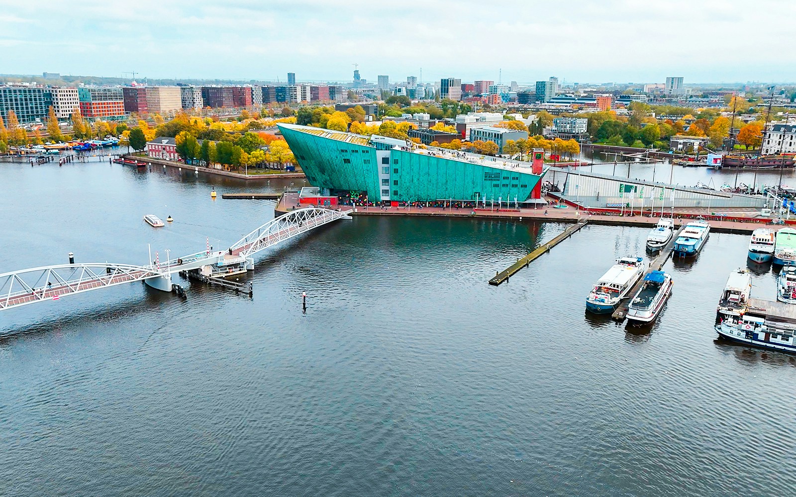 NEMO Science Museum in Amsterdam with surrounding water and boats.