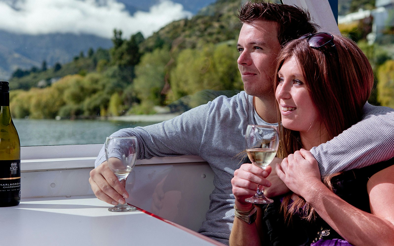 Lake Wakatipu cruise boat with scenic mountain backdrop, Queenstown, New Zealand.