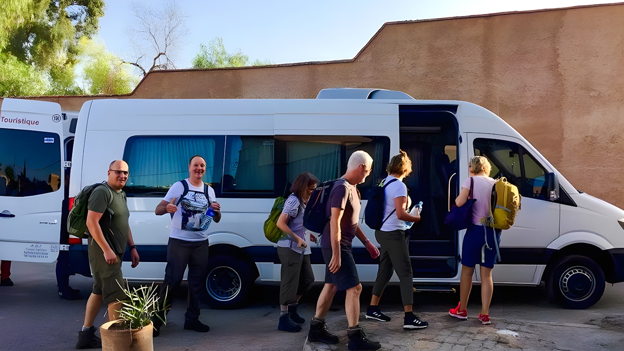 Travelers boarding a van for Agafay Desert tour in Marrakech.