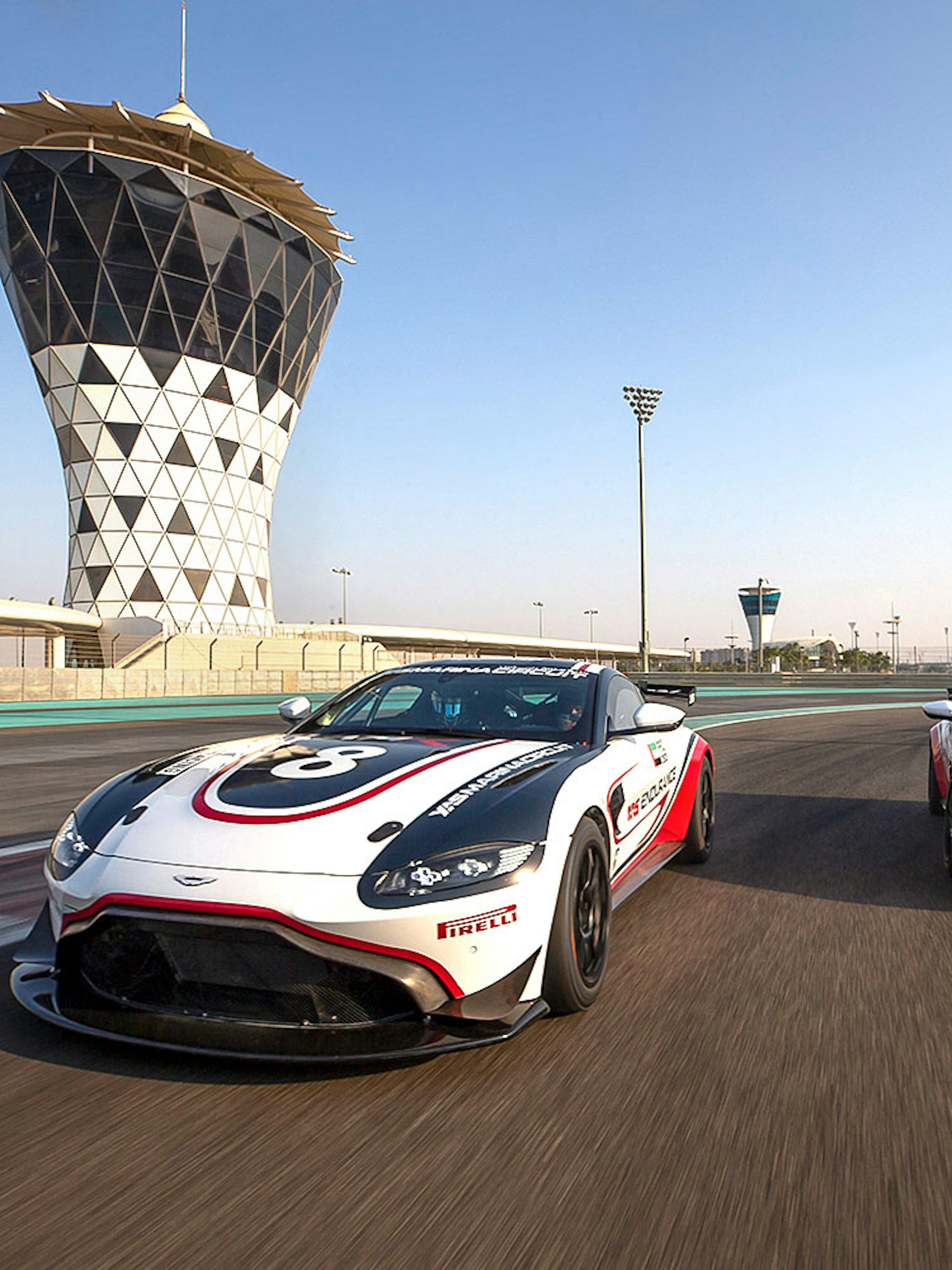 Aston Martin GT4 cars racing at Yas Marina Circuit, Abu Dhabi.
