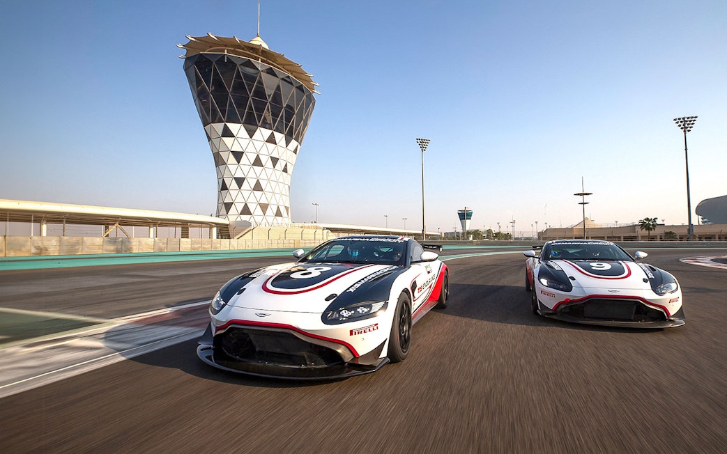 Aston Martin GT4 cars racing at Yas Marina Circuit, Abu Dhabi.