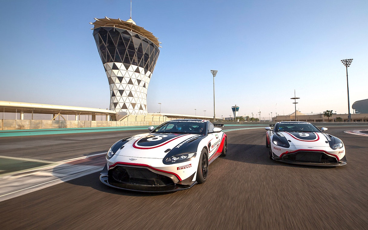 Aston Martin GT4 cars racing at Yas Marina Circuit, Abu Dhabi.