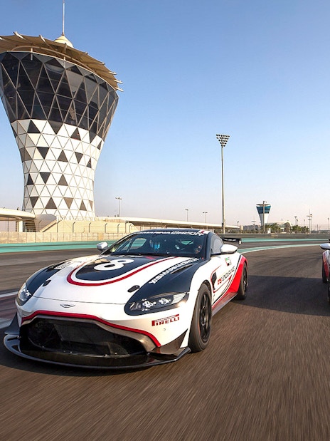 Aston Martin GT4 cars racing at Yas Marina Circuit, Abu Dhabi.