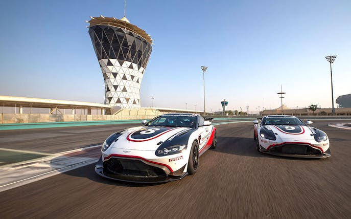 Aston Martin GT4 cars racing at Yas Marina Circuit, Abu Dhabi.