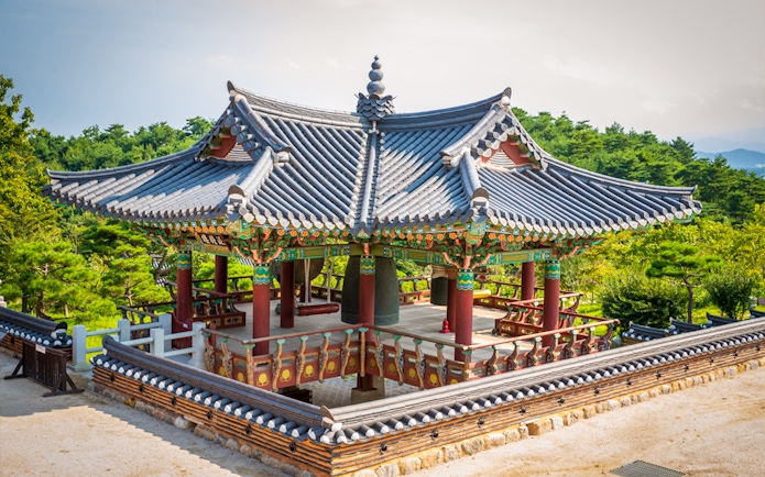 Naksansa Temple pavilion with traditional architecture near Mt. Seorak, surrounded by greenery.