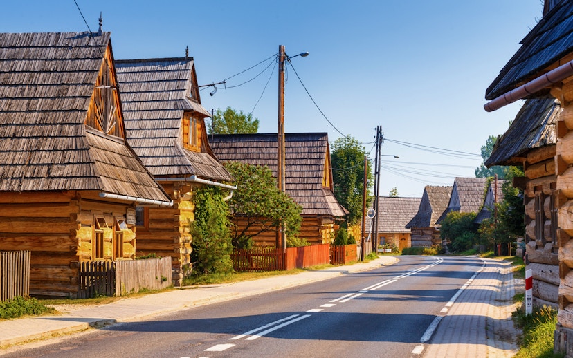 Traditional wooden houses along a road in Zakopane, near Morskie Oko, Poland.