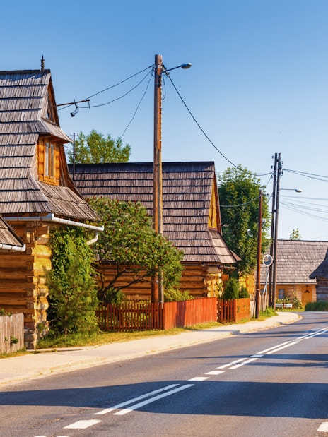 Traditional wooden houses along a road in Zakopane, near Morskie Oko, Poland.