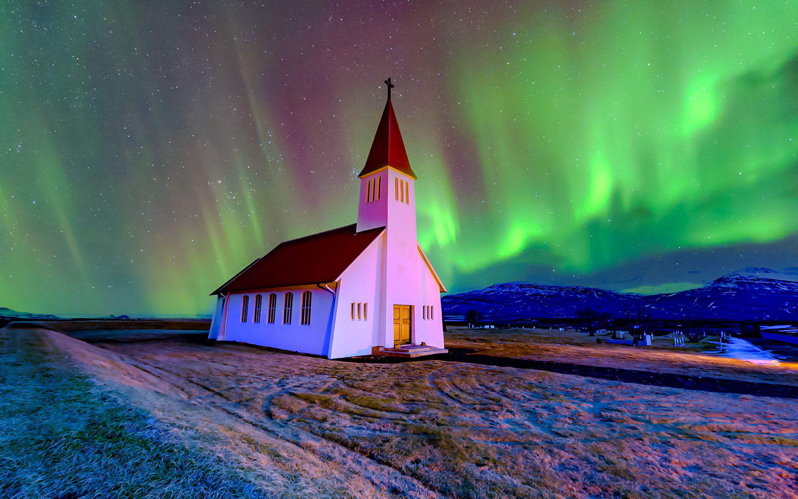 Vikurkirkja church under northern lights, Reykjavik.
