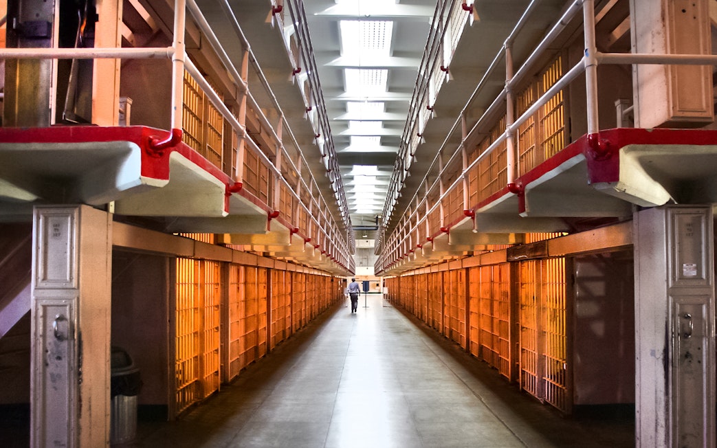 Alcatraz Prison cell block interior during San Francisco Bay cruise tour.