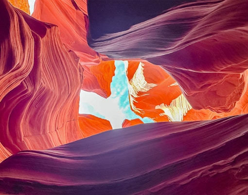 Antelope Canyon X rock formations with sunlight filtering through, Arizona.