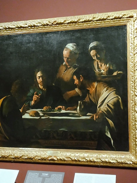 Caravaggio's "The Supper at Emmaus" painting displayed at Pinacoteca di Brera, Milan.