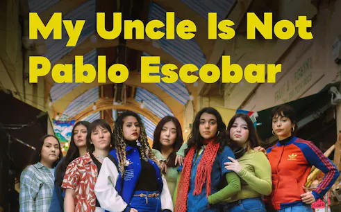 Group of women standing under a market roof, promoting "My Uncle Is Not Pablo Escobar" West End show.