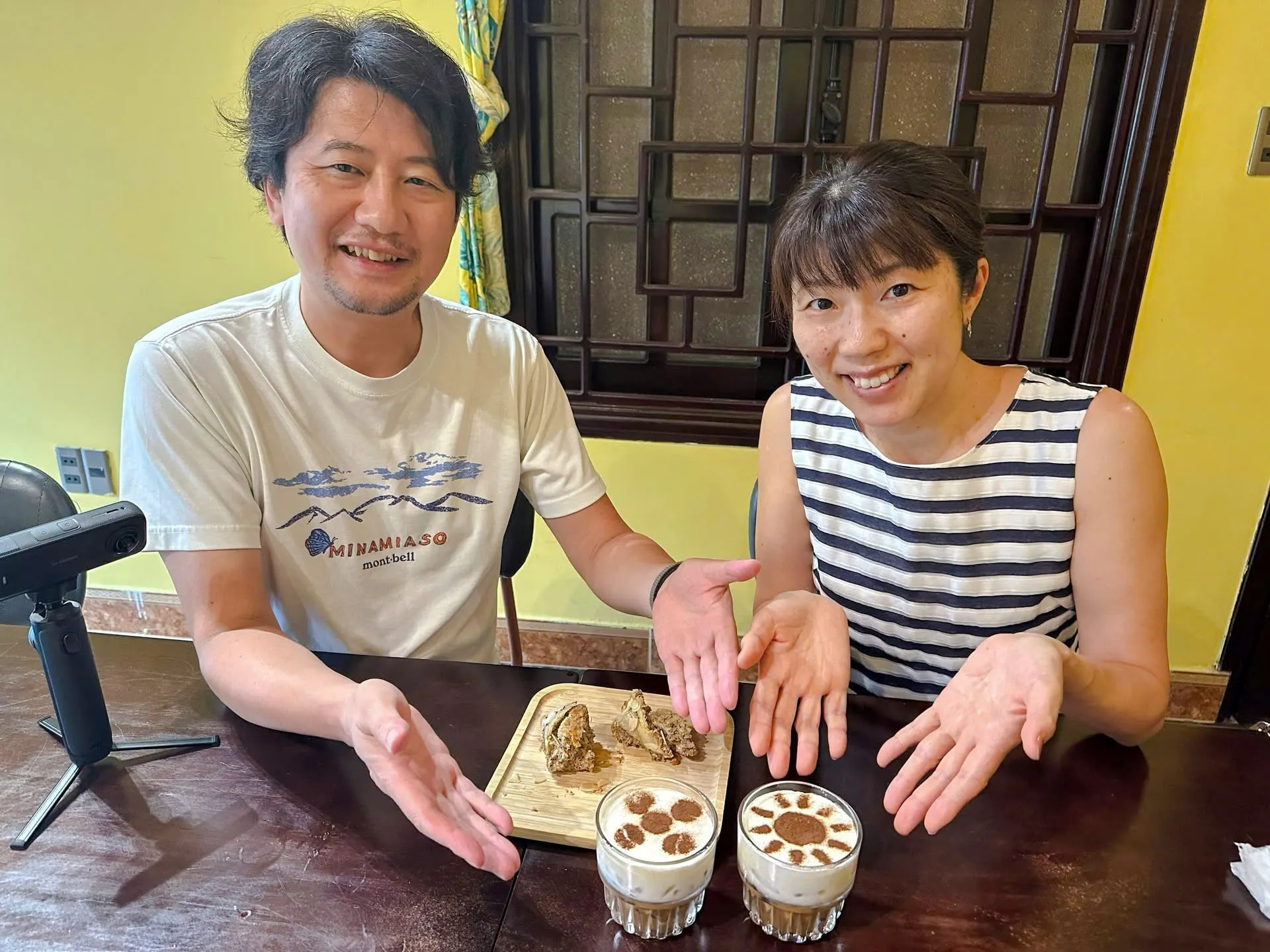 Couple enjoying a DIY coffee-making experience in Da Nang, showcasing coffee beans.