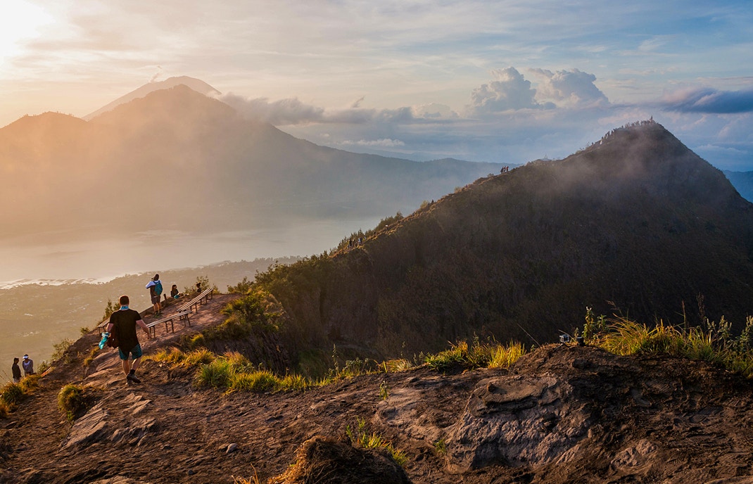 people hiking mount batur