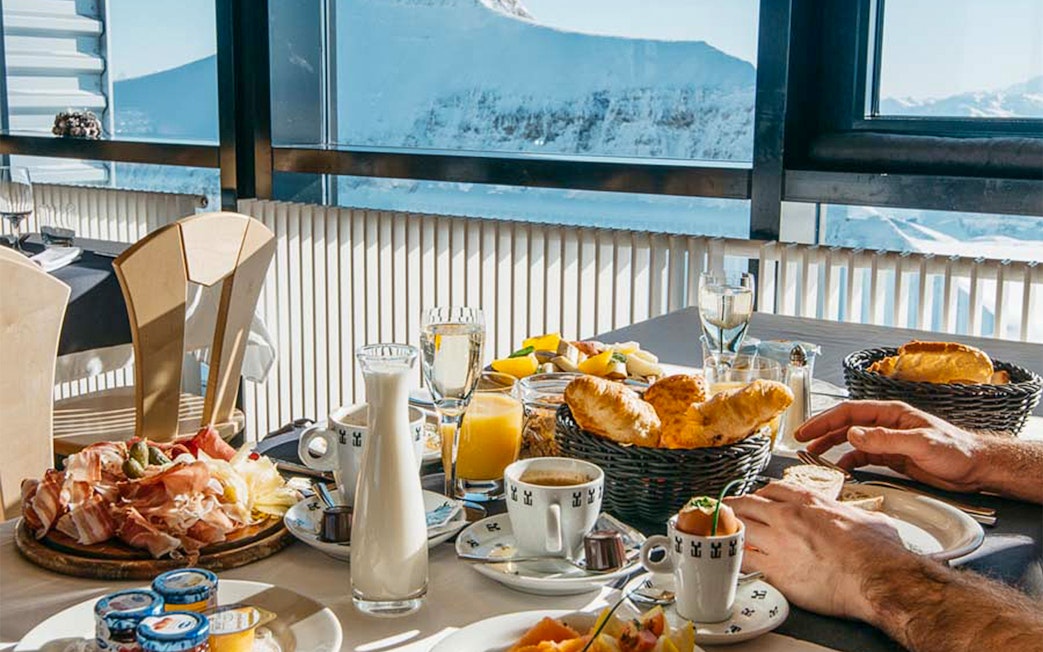 Dining with a view of snowy peaks at Glacier 3000, Les Diablerets.