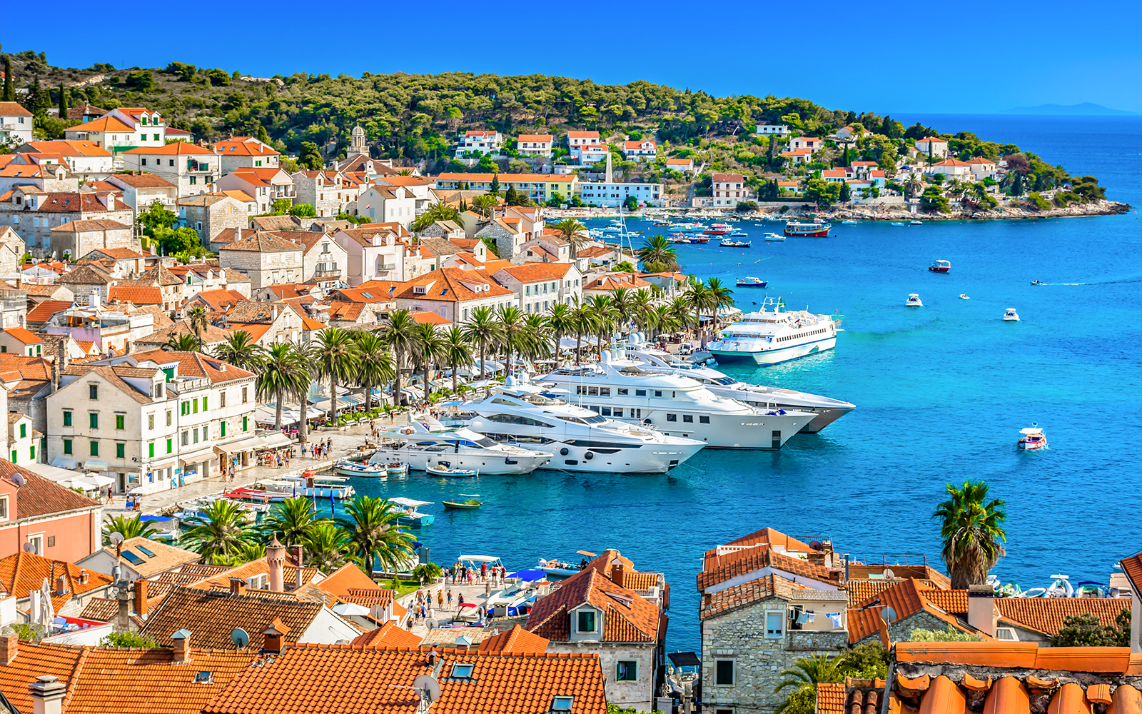 Aerial view of Hvar town's coastline and historic buildings in Southern Croatia.