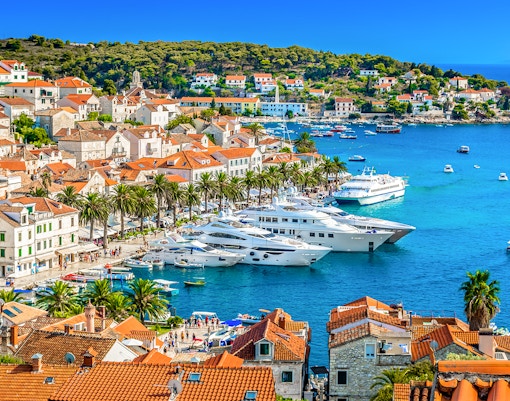 Aerial view of Hvar town's coastline and historic buildings in Southern Croatia.
