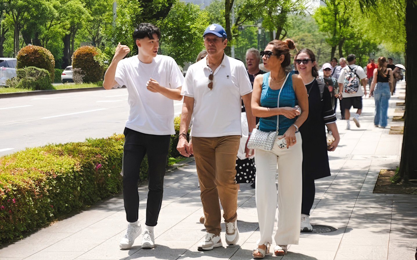 Tour group walking near Tokyo's Imperial Palace on a guided Shogun tour.