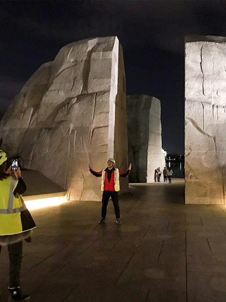 Tourists photographing at the Martin Luther King Memorial at night, Washington D.C.
