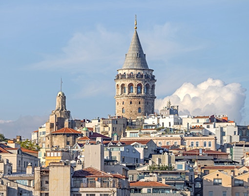Galata Tower in Istanbul with cityscape view in the background.