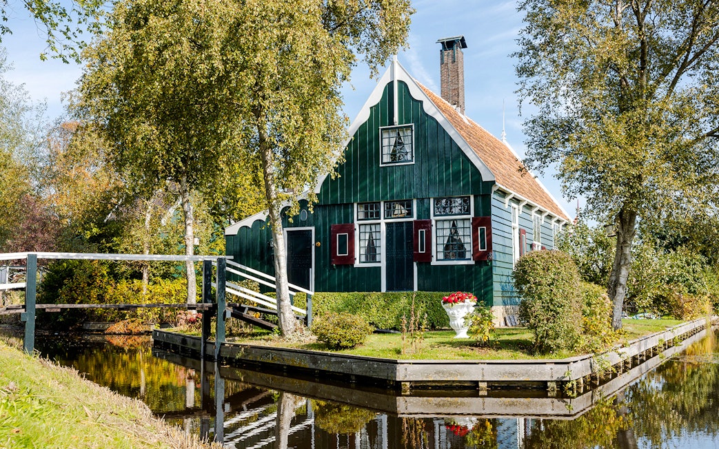 Traditional Dutch house by a canal at Zaanse Schans, Netherlands.