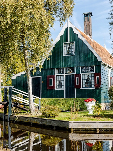 Traditional Dutch house by a canal at Zaanse Schans, Netherlands.