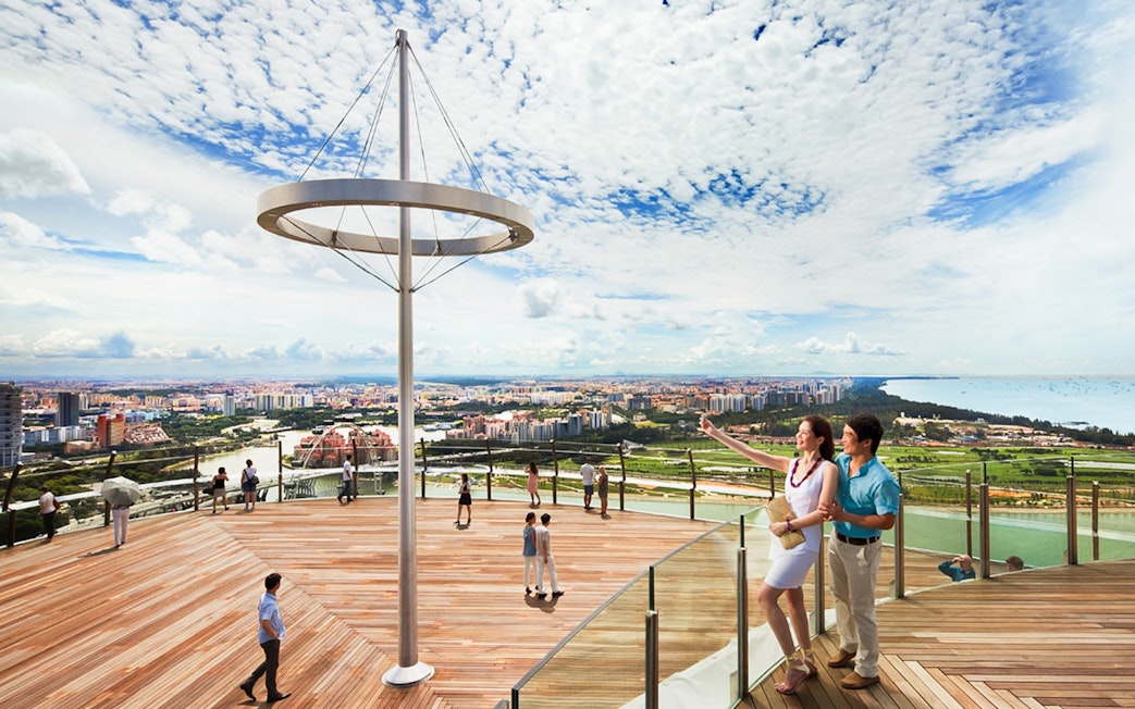 Visitors enjoying the view from Marina Bay Sands SkyPark Observation Deck, Singapore.