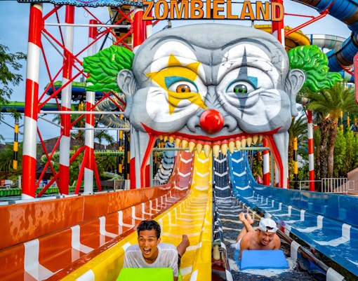 Water slide at Zombieland, Columbia Pictures Aquaverse Pattaya, with riders enjoying the thrill.