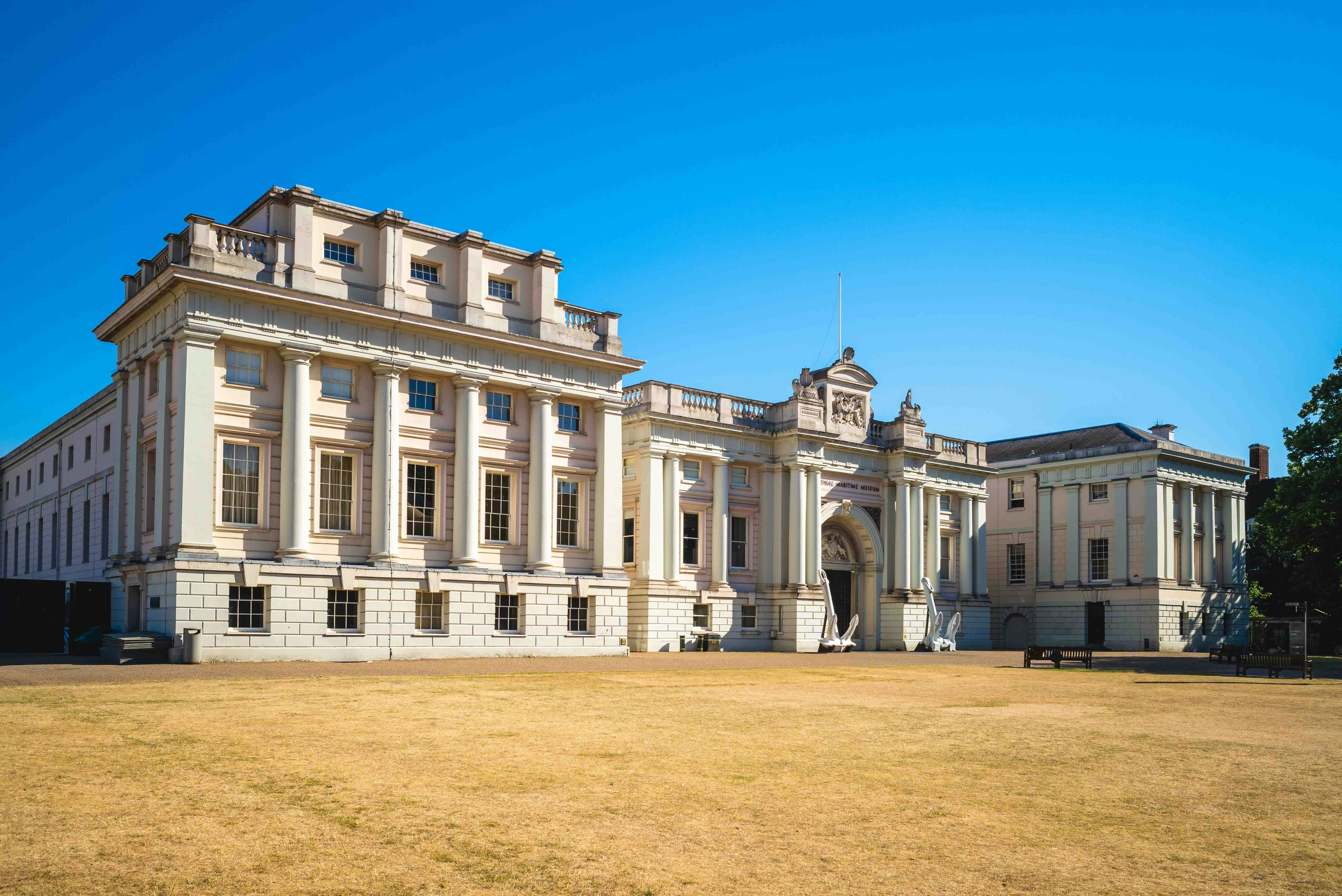 National Maritime Museum entrance in London with neoclassical architecture.