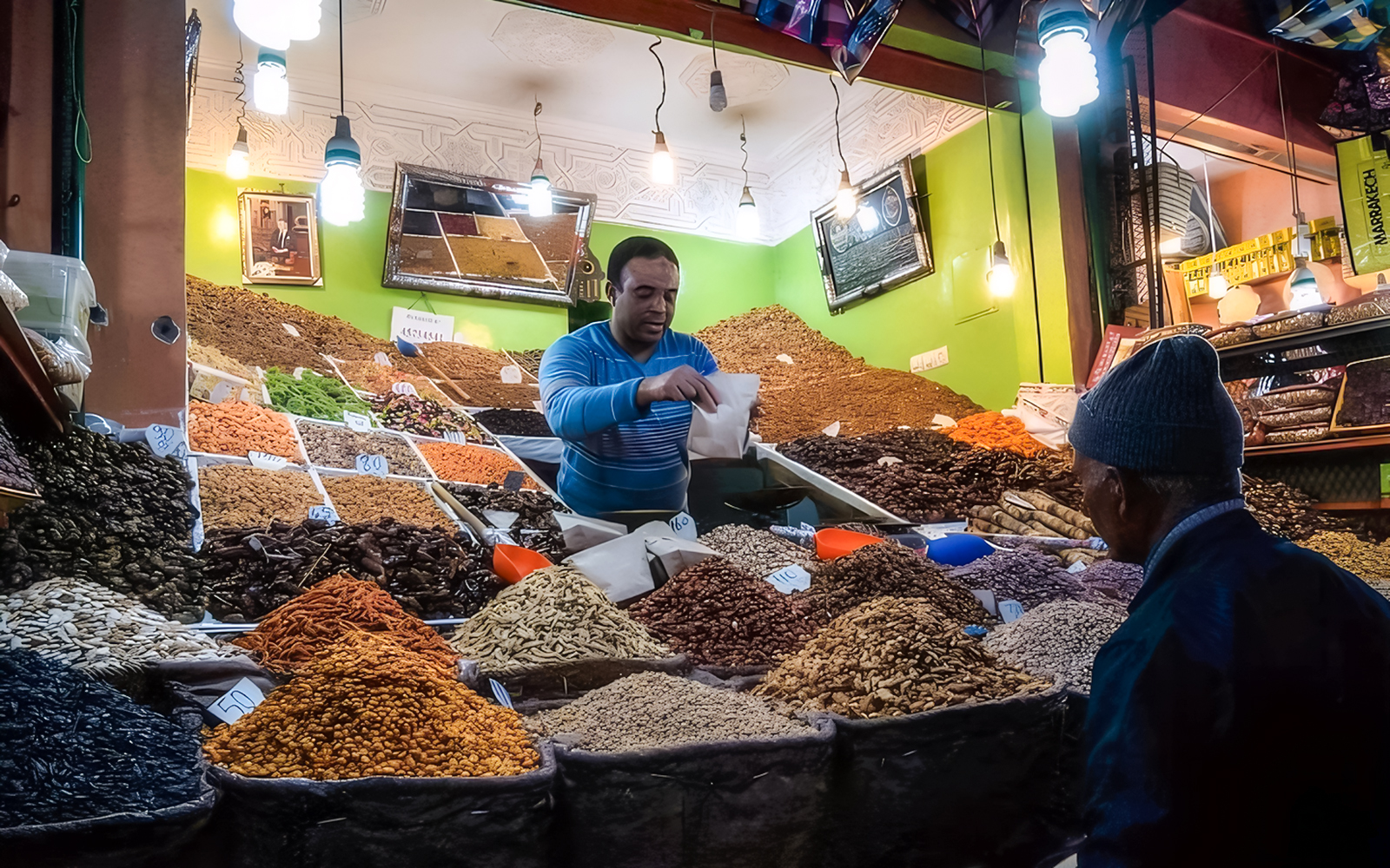 Vendor selling spices at a Marrakech market during a night walking tour.