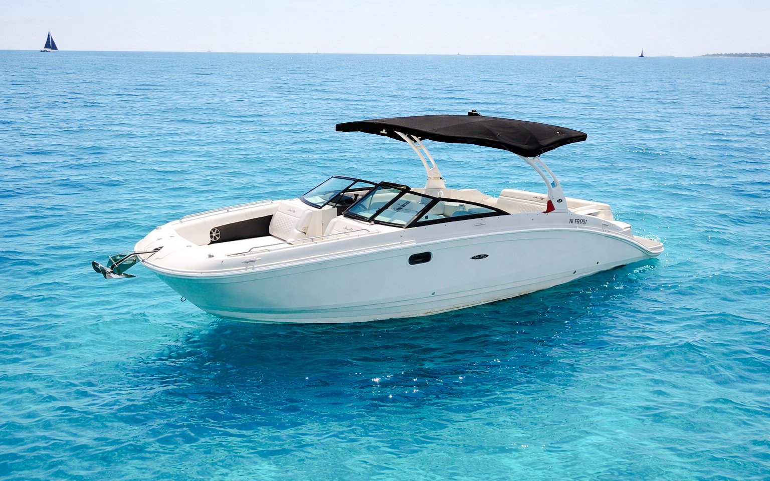 Private boat on clear blue waters near Lérins Islands, Cannes.