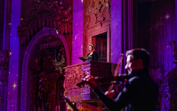 Performers at light show inside Clérigos Church, Porto.