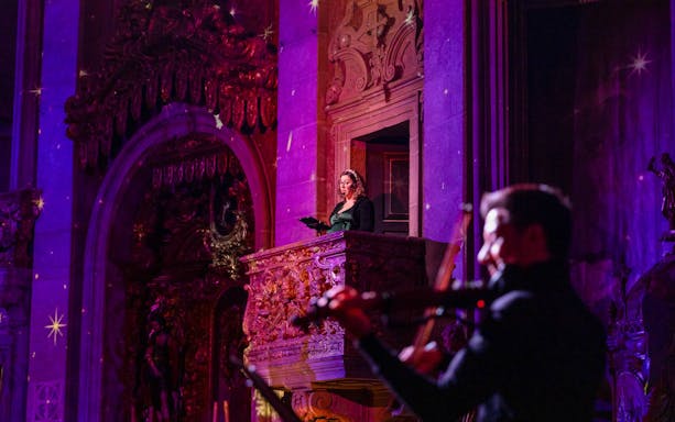 Performers at light show inside Clérigos Church, Porto.