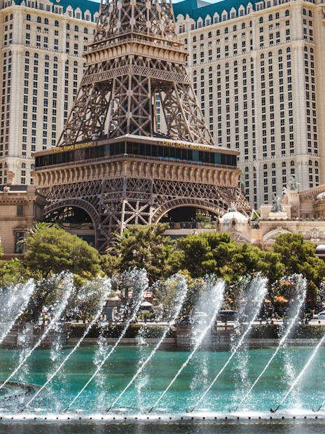 Eiffel Tower replica with fountain display in Las Vegas.