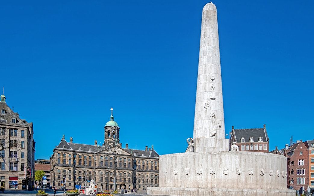 Dam Square with National Monument and Royal Palace in Amsterdam.