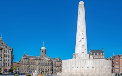 Dam Square with National Monument and Royal Palace in Amsterdam.