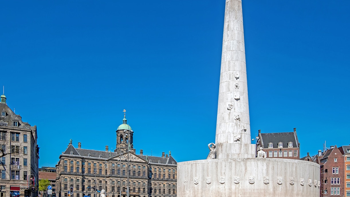 Dam Square with National Monument and Royal Palace in Amsterdam.